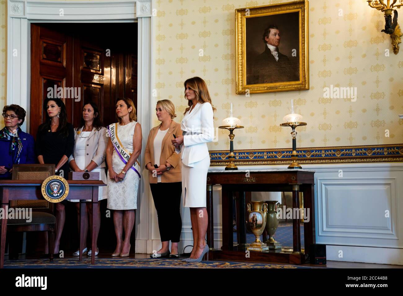 Washington, DC, USA. 18th Aug, 2020. First Lady Melania Trump participates in the signing ceremony to mark the 100th Anniversary of the Ratification of the 19th Amendment at the White House in Washington, DC, USA, 18 August 2020. This year marks the 100th anniversary of the 19th amendment in the United States, which guaranteed American women the right to vote. Credit: Anna Moneymaker/Pool via CNP | usage worldwide Credit: dpa/Alamy Live News Stock Photo