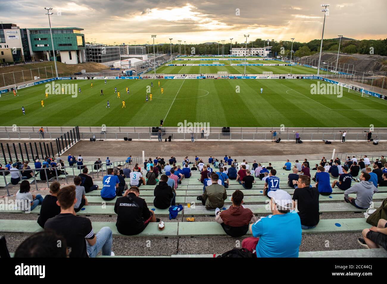 dpatop - 18 August 2020, North Rhine-Westphalia, Gelsenkirchen: Football, tryouts: FC Schalke 04 - KFC Uerdingen. A total of 300 admitted spectators sit in the old Parkstadion and watch the game. Photo: Guido Kirchner/dpa Stock Photo