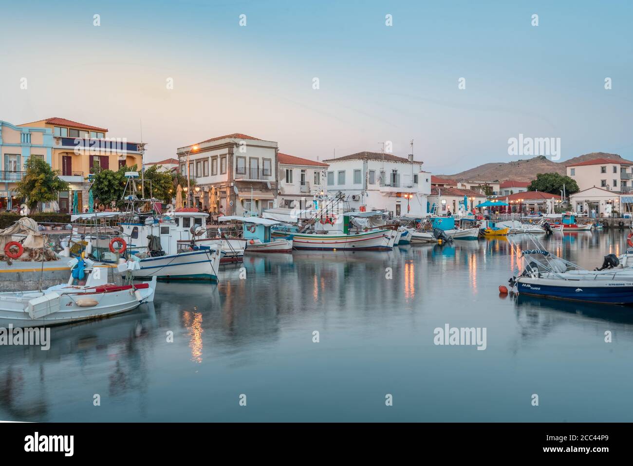 Myrina, Lemnos island, Greece the magical touristic Greek islands at sunset. Port of Limnos panoramic view at dusk. Long exposure HDR landscape photog Stock Photo