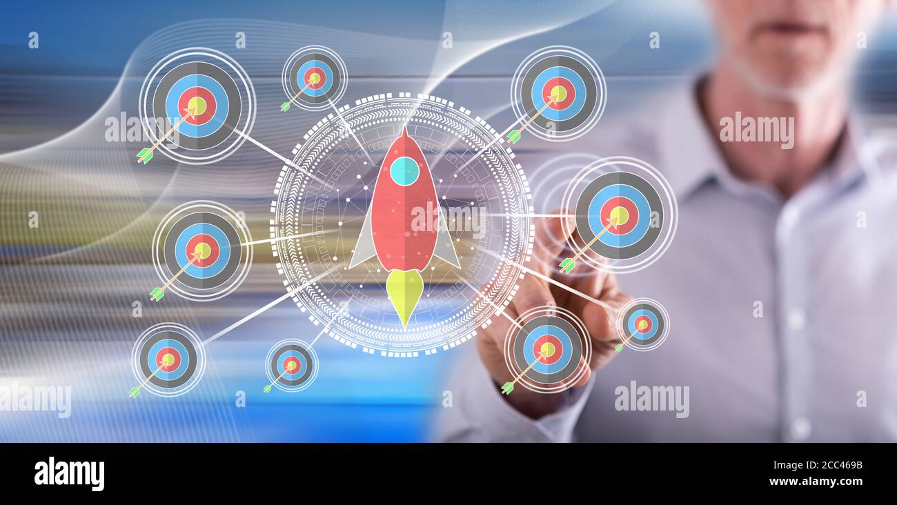 Man touching a business target concept on a touch screen with his ...
