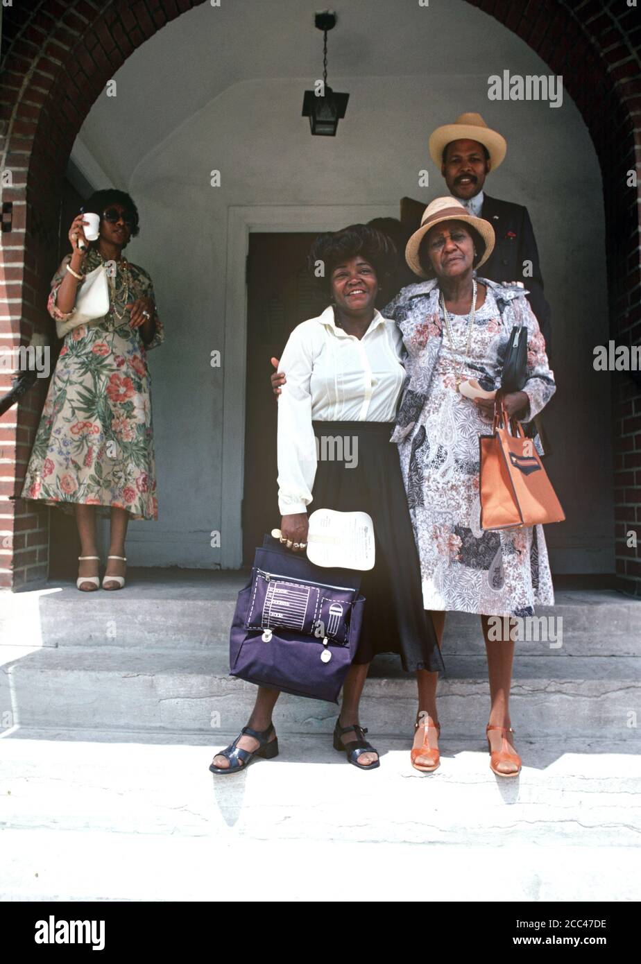 AFRICAN AMERICANS OUTSIDE ST LOUIS BABTIST CHURCH, MISSOURI, USA, 70s Stock Photo