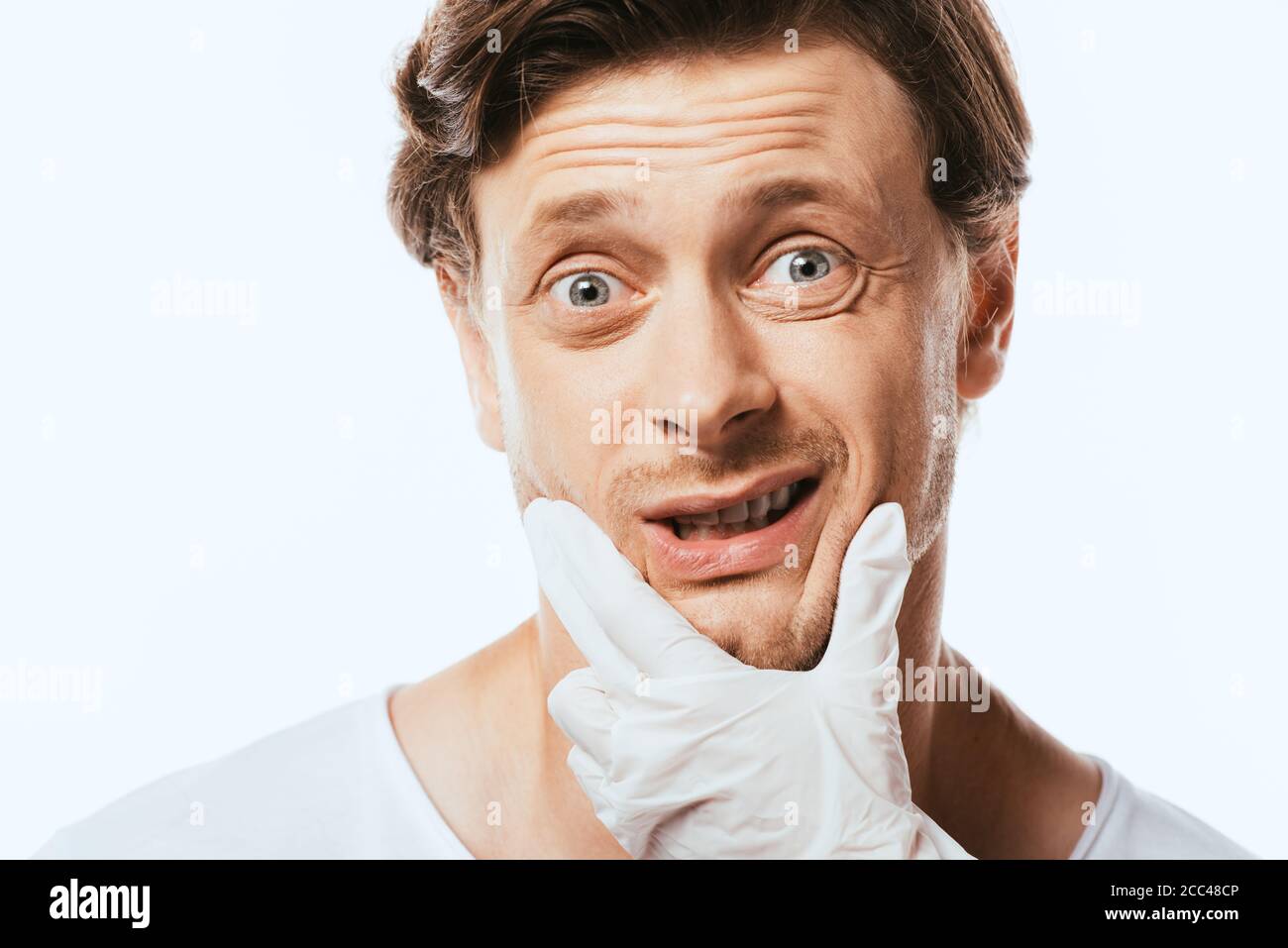 Doctor touching chin in medical hi-res stock photography and images - Alamy