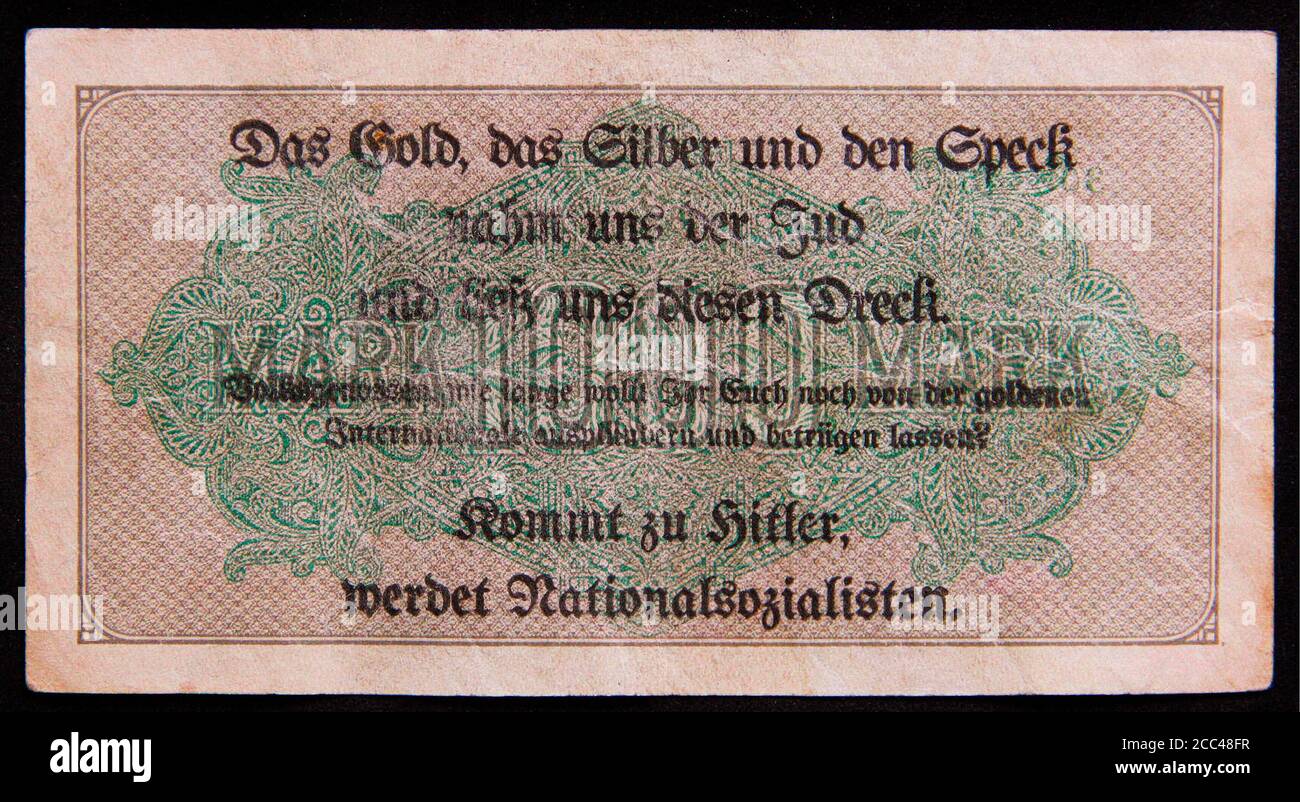 Nazi Germany. The 1000 Mark's banknote with anti semitic overprint. 1930s Nazi party advertising 1932 election propaganda 'leaflet' created by printin Stock Photo