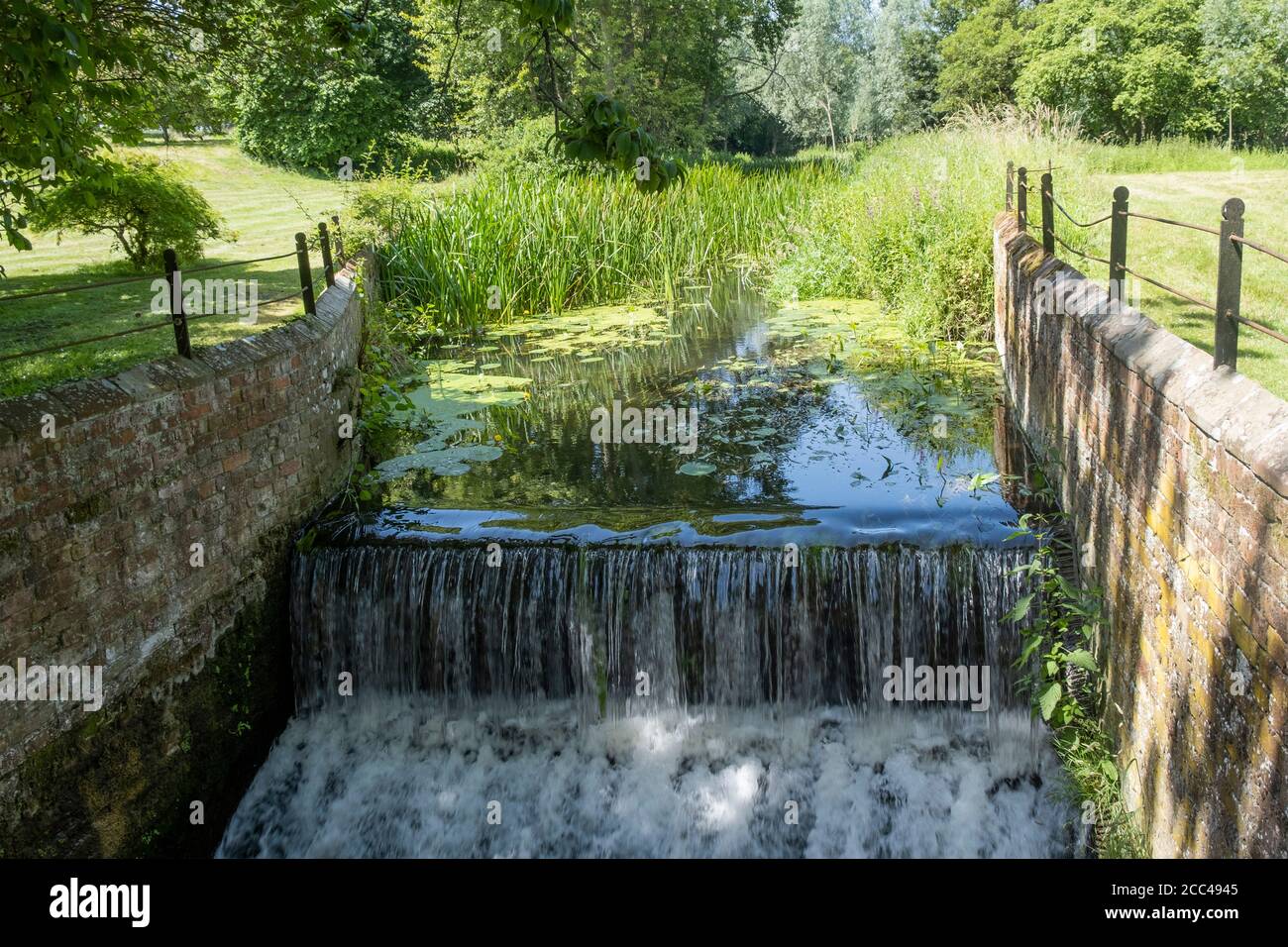 Small canal weir on Langleys estate in Great Waltham, Essex, England