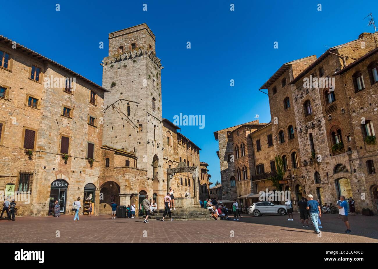 Great view of the Piazza della Cisterna, the main square of San Gimignano, Tuscany. Named after