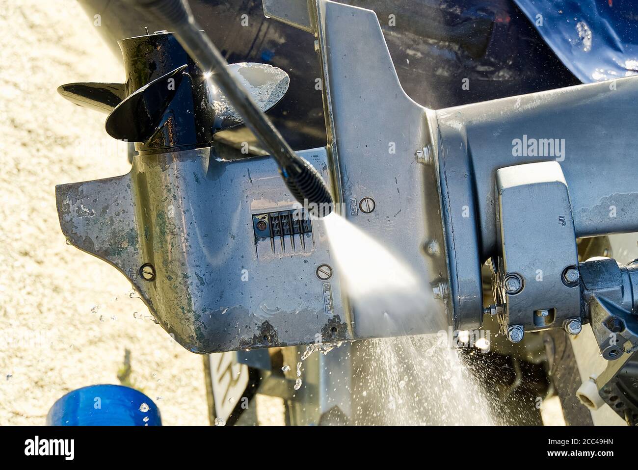 washing service of outboard motor by pressure. selective focus. Stock Photo