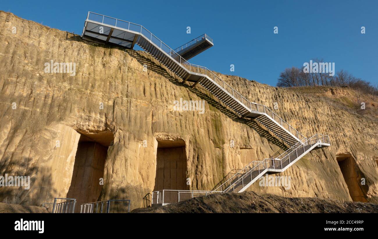 Stairs leading into the ENCI quarry from the viewing platform. ENCI is a former cement factory near Maastricht, the Netherlands. Stock Photo
