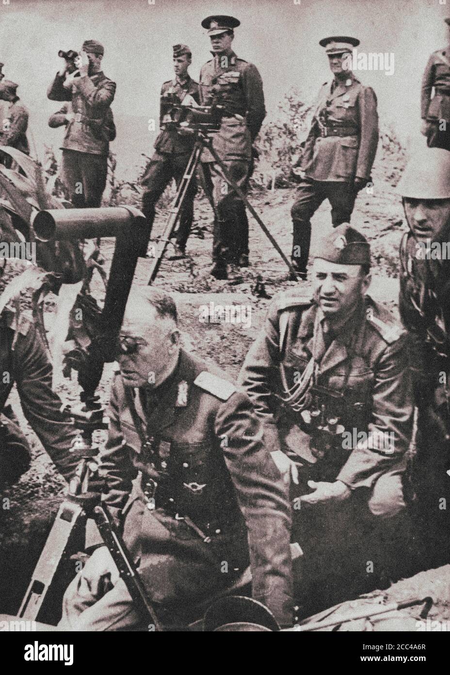 King of Romania Mihai I (in the center, in the second row) watches the course of military exercises of the Romanian army against the Soviet troops. In Stock Photo