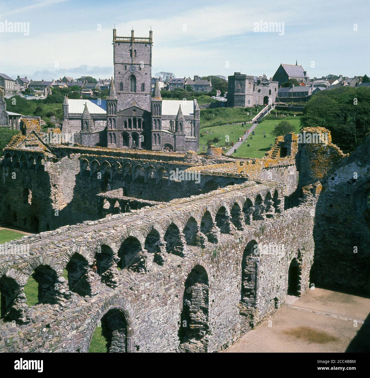 1960s, historical, a view from this era over anicent buildings towards the Cathedral Church of St Andrew and St David, at The Pebbles, St David's, Haverfordwest in Wales, The parton saint of Wales, St David, founded a monastery there in the 6th century, with the cathedral being built by a Norman Bishop in 1180. Buried there, his shrine was a popular place of pilgrimage throughout the Middle Ages.  St David's was a made a city in 1994 to mark its role in Christian heritage and is the UK's smallest city. Stock Photo
