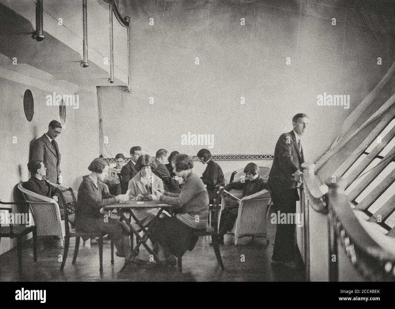 Passengers pass the time in the His Majesty's Airship R100’s lounge. 1929. Stock Photo