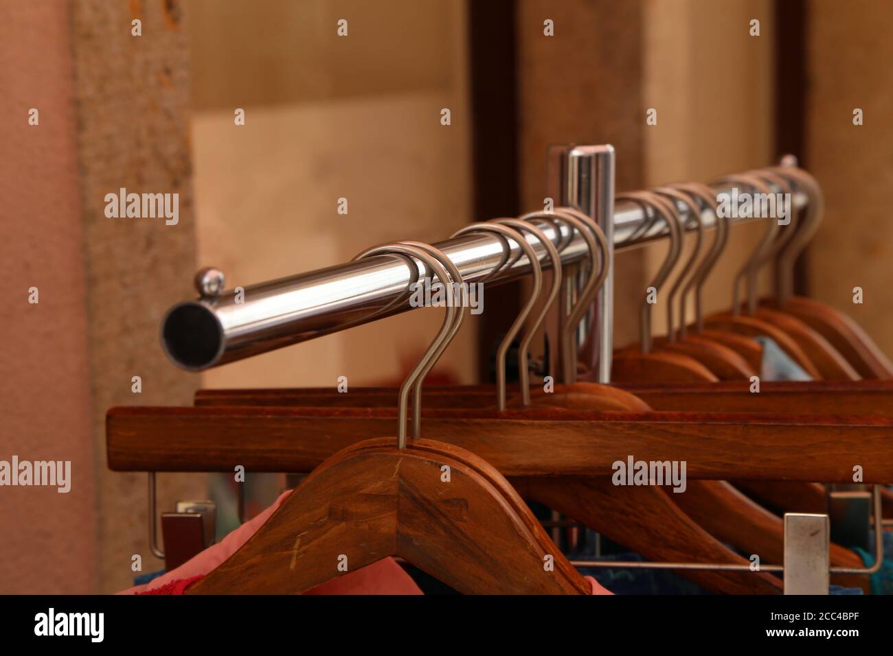 Empty wooden hangers in a fashion store Stock Photo Alamy