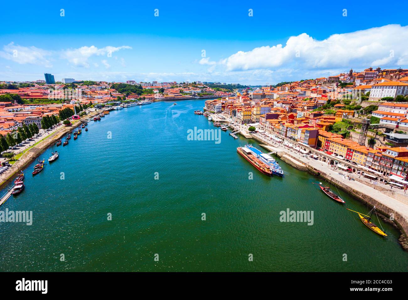 Douro river and local houses with orange roofs in Porto city aerial