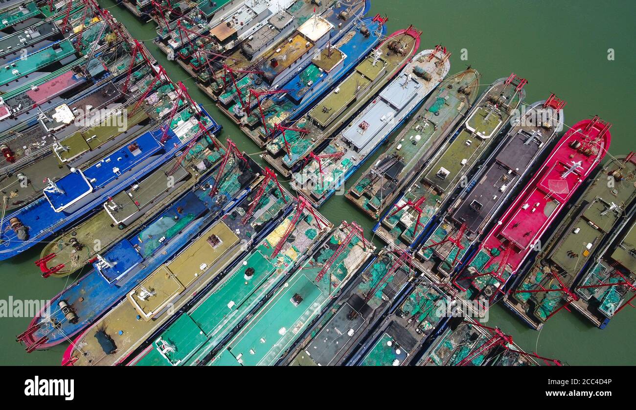 (200818) -- HAIKOU, Aug. 18, 2020 (Xinhua) -- Aerial photo taken on Aug. 18, 2020 shows fishing boats at Xin'gang harbour in the city of Haikou, south China's Hainan Province.  Typhoon Higos is expected to bring torrential downpours to regions in southern China in the following days.   A tropical depression in the northeast of the South China Sea intensified into a typhoon at around 8 a.m. Tuesday, according to the meteorological department of Hainan Province.   The emergency management department of Hainan has issued a typhoon alert, warning that fishing boats and other vessels should return Stock Photo