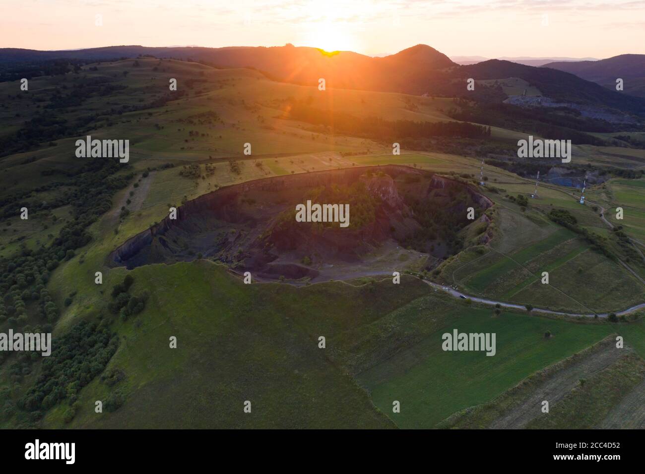 Vulcan Racos Aerial view of Racos volcanic crater in the sunrise, Brasov county ...