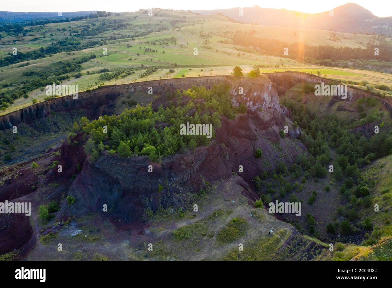 Vulcan Racos Aerial view of Racos volcanic crater in the sunrise, Brasov county ...