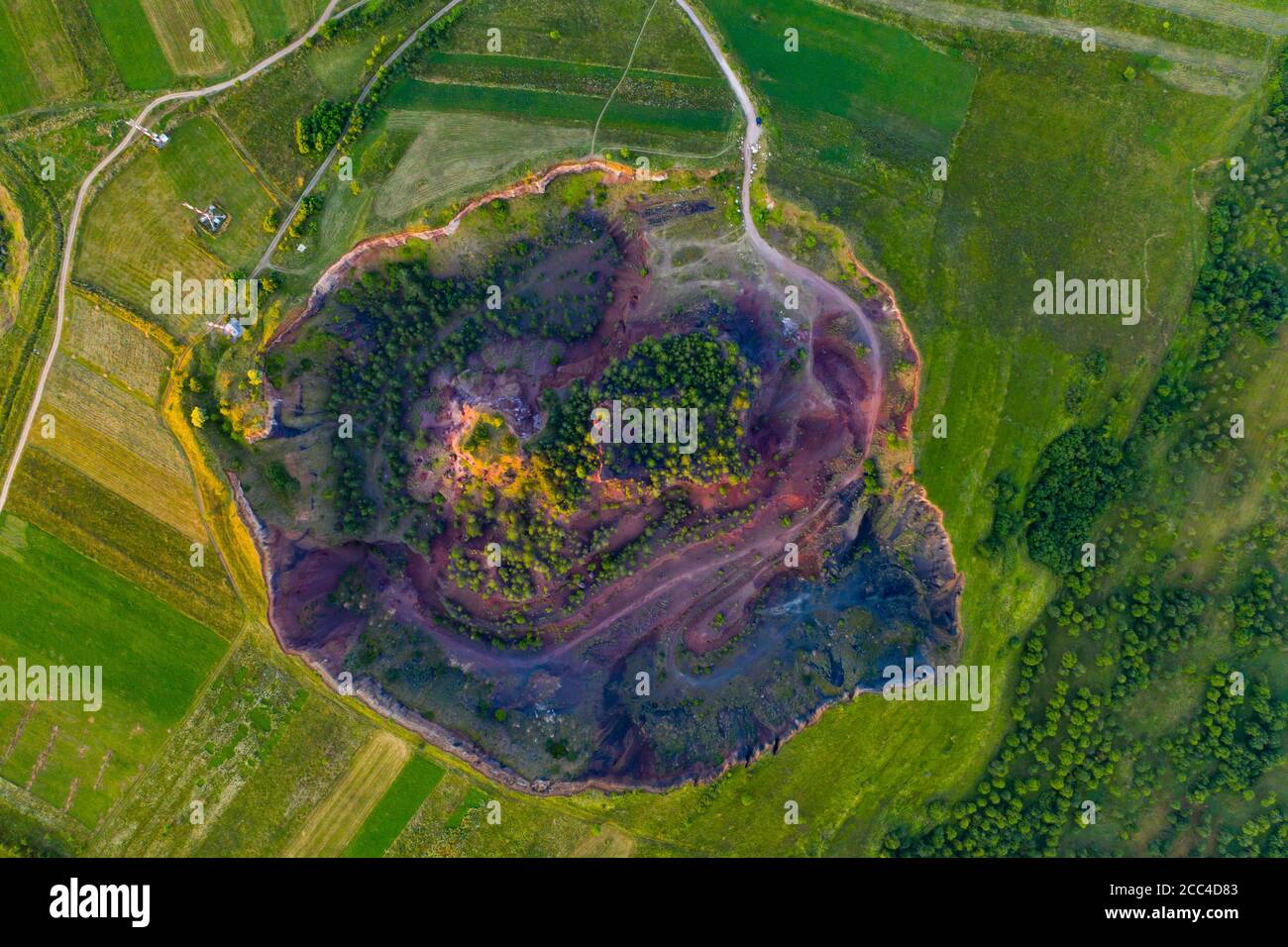 Vulcan Racos Aerial view of Racos volcanic crater in the sunrise, Brasov county ...
