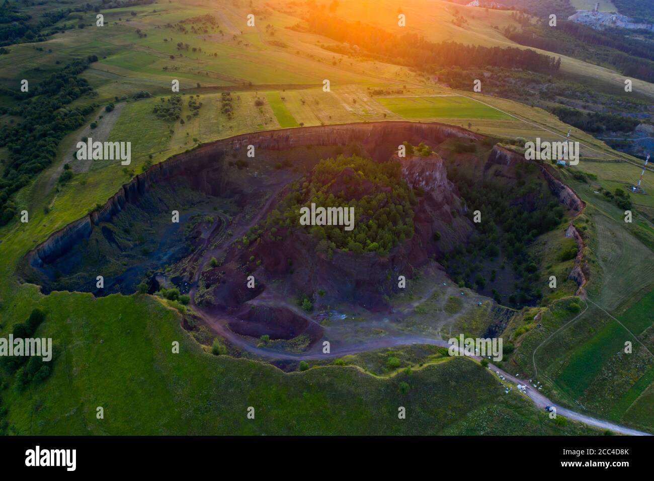 Vulcan Racos Aerial view of Racos volcanic crater in the sunrise, Brasov county ...