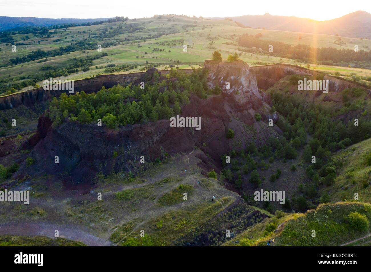 Vulcan Racos Aerial view of Racos volcanic crater in the sunrise, Brasov county ...