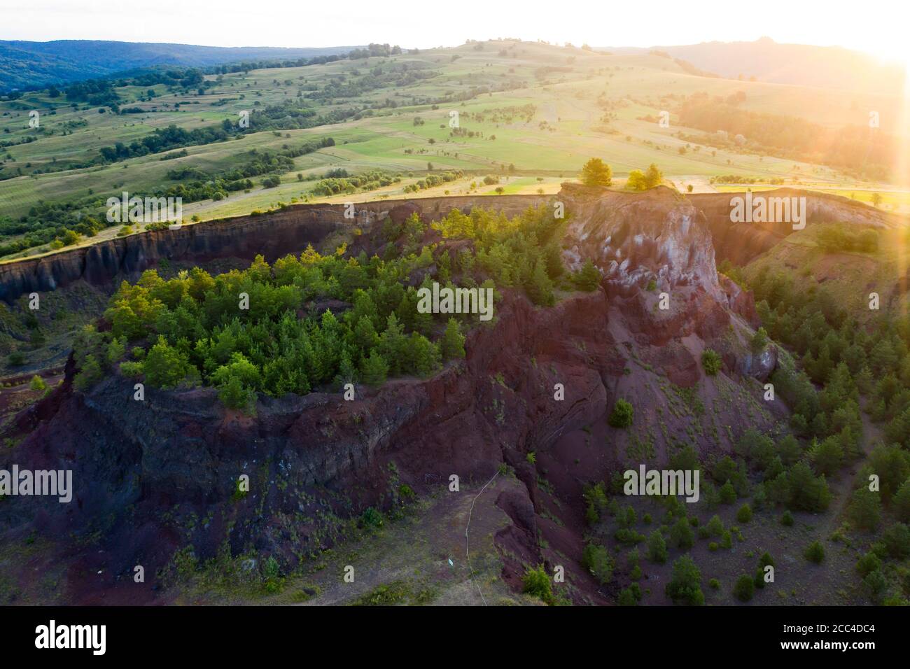 Vulcan Racos Aerial view of Racos volcanic crater in the sunrise, Brasov county ...