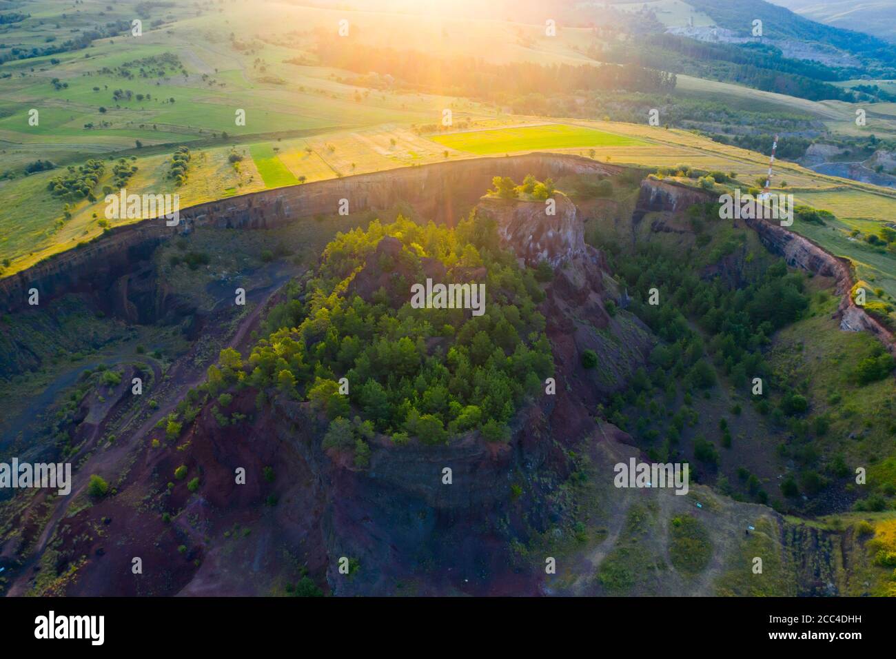 Vulcan Racos Aerial view of Racos volcanic crater in the sunrise, Brasov county ...