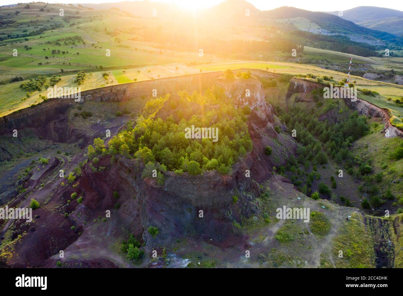 Vulcan Racos Aerial view of Racos volcanic crater in the sunrise, Brasov county ...