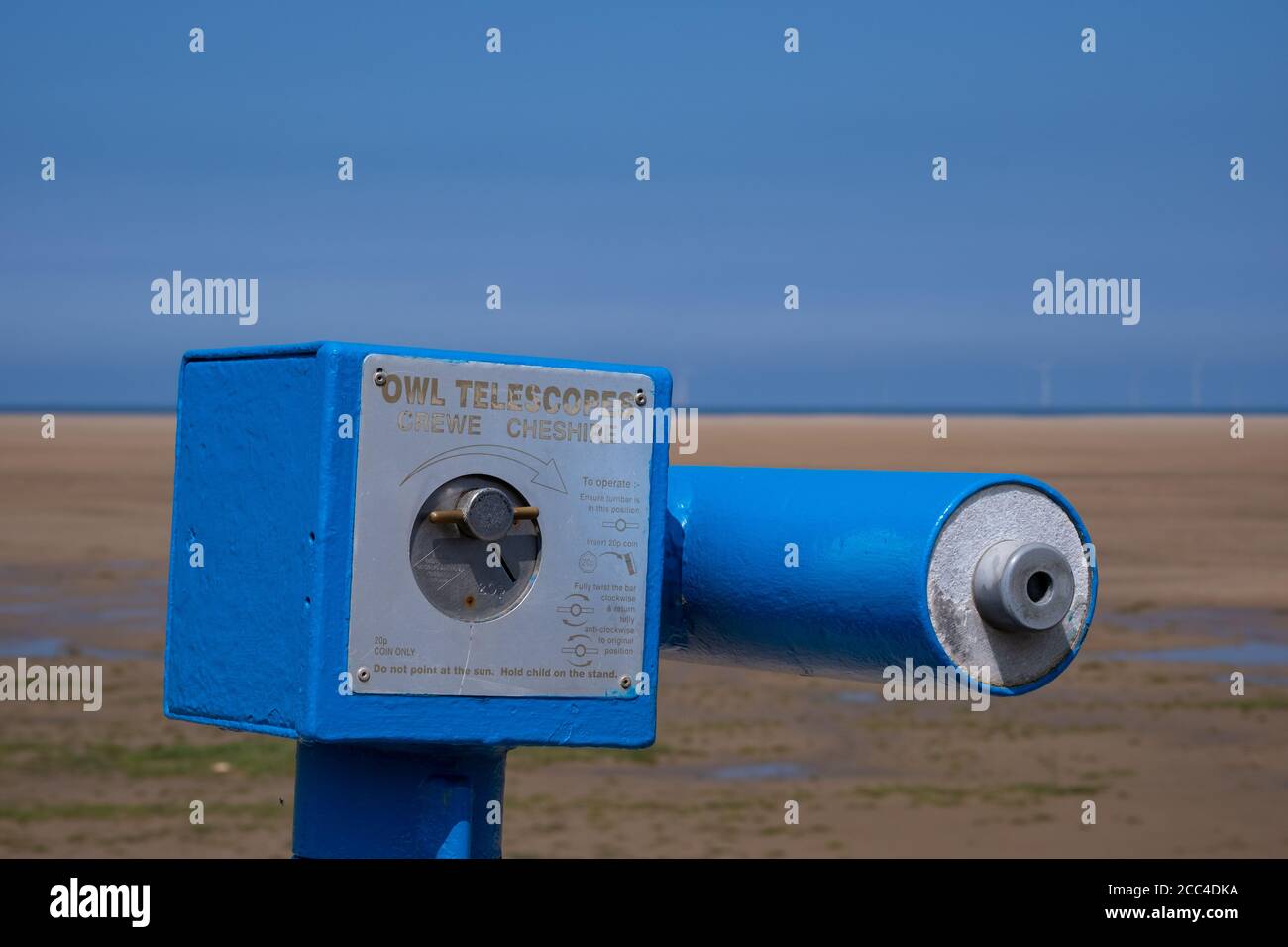 Coin operated blue telescope at the seaside in Hoylake Wirral June 2020 Stock Photo