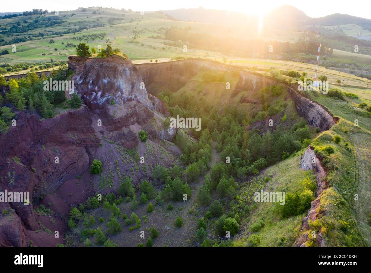 Vulcan Racos Aerial view of Racos volcanic crater in the sunrise, Brasov county ...