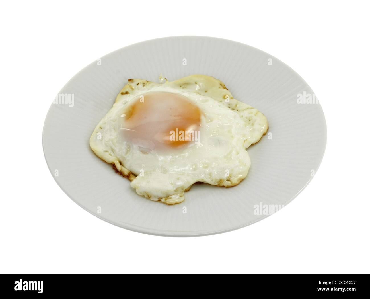 Fried egg on a plate isolated on white background Stock Photo - Alamy