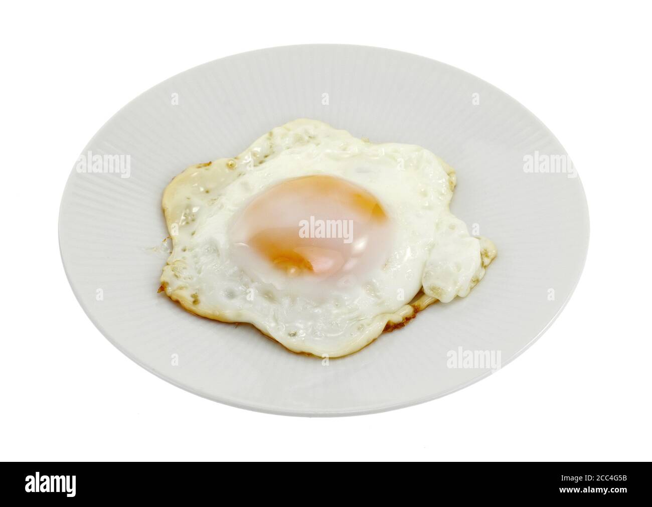 Fried egg on a plate isolated on white background Stock Photo - Alamy