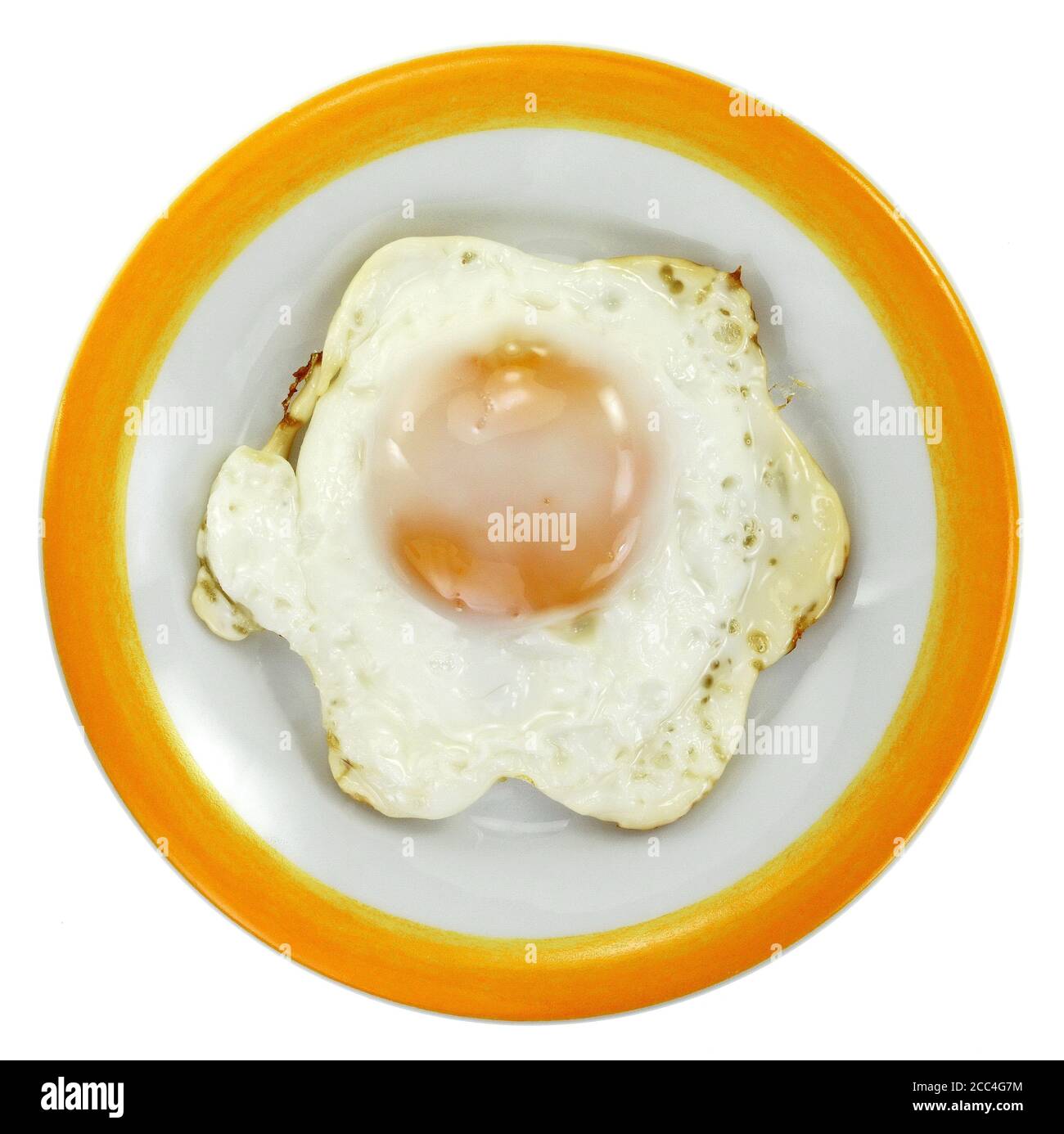 Fried egg on a plate isolated on white background Stock Photo - Alamy