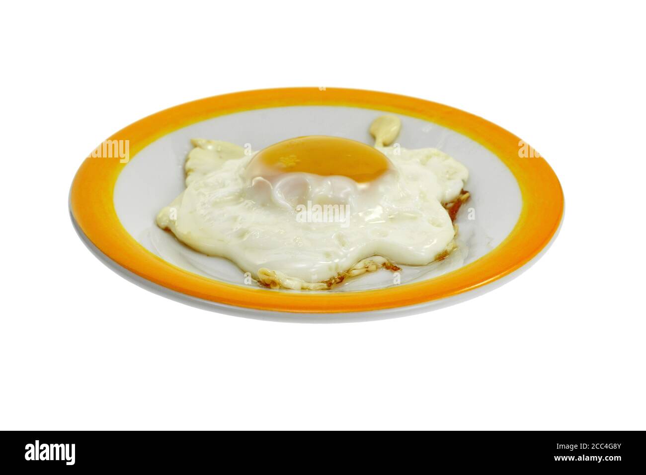 Fried egg on a plate isolated on white background Stock Photo - Alamy