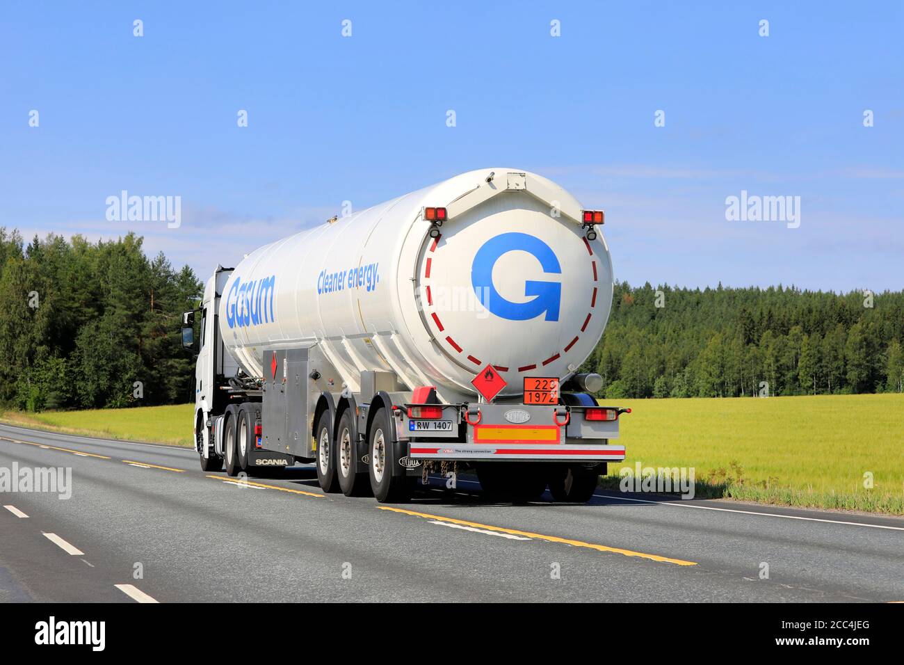 White Scania semi tank truck Gasum hauls LNG, Liquified natural gas, ADR 223-1972, on  Highway 2 in the summer. Jokioinen, Finland. August 14, 2020. Stock Photo
