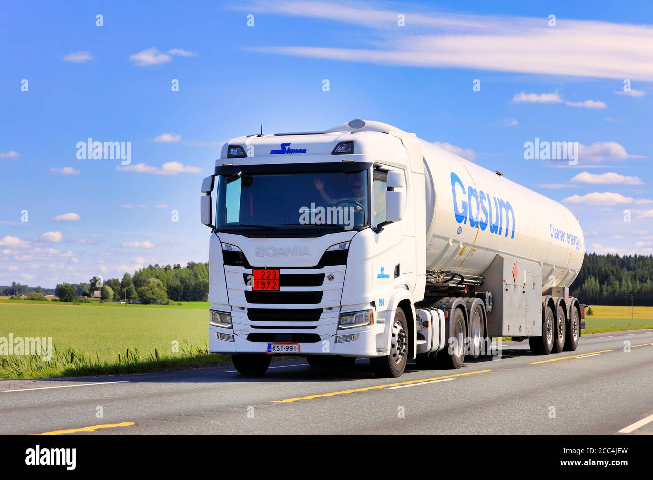 White Scania semi tank truck Gasum hauls LNG, Liquified natural gas, ADR 223-1972, on  Highway 2 in the summer. Jokioinen, Finland. August 14, 2020. Stock Photo