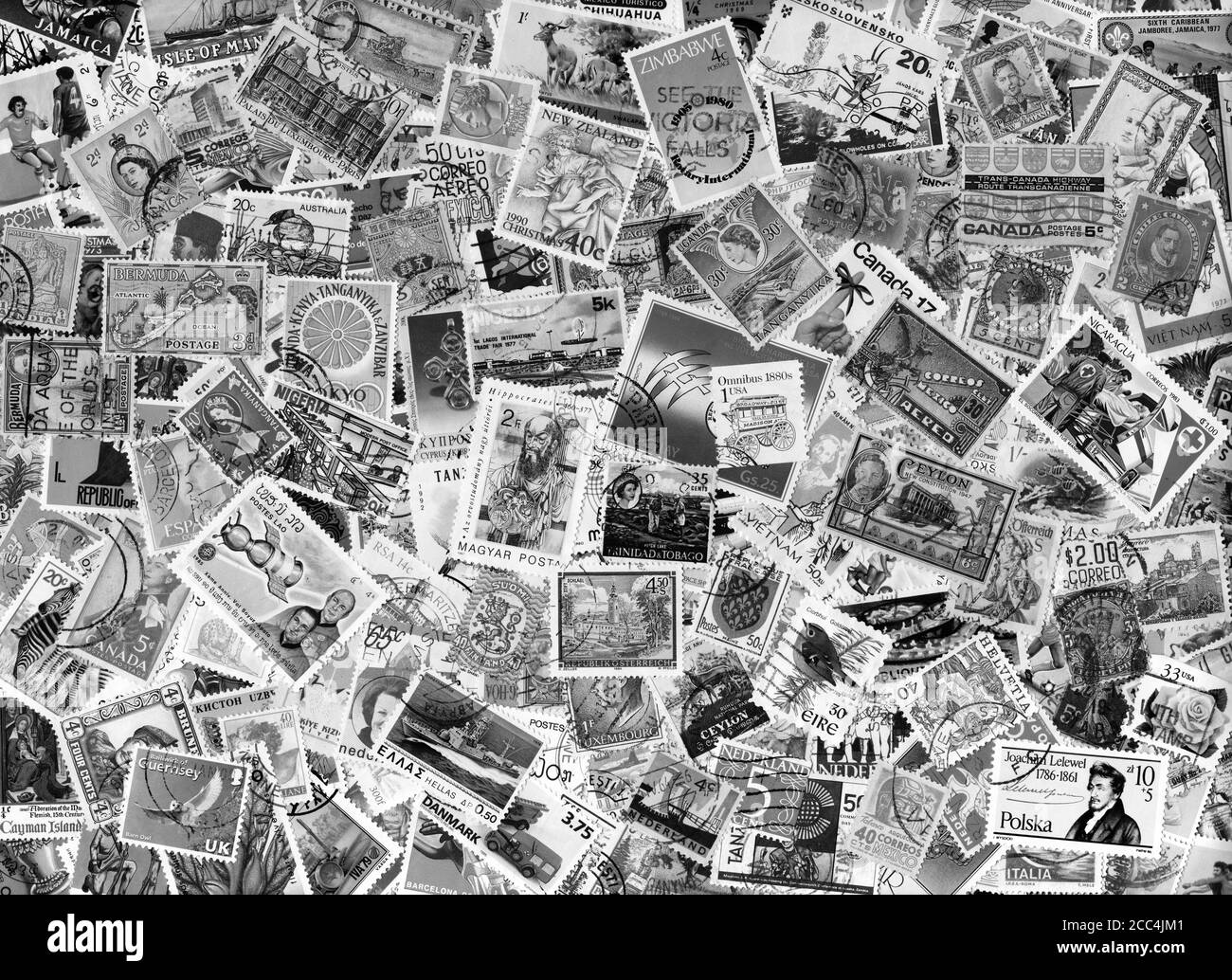 Large world foreign postage stamp collection background black and white monochrome image  stock photo Stock Photo