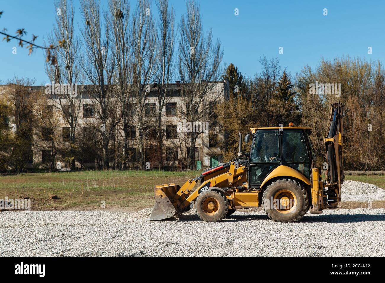 Dneprorudnoe/Ukraine - April 08 2020: A tractor pours the gravel from the bucket Stock Photo