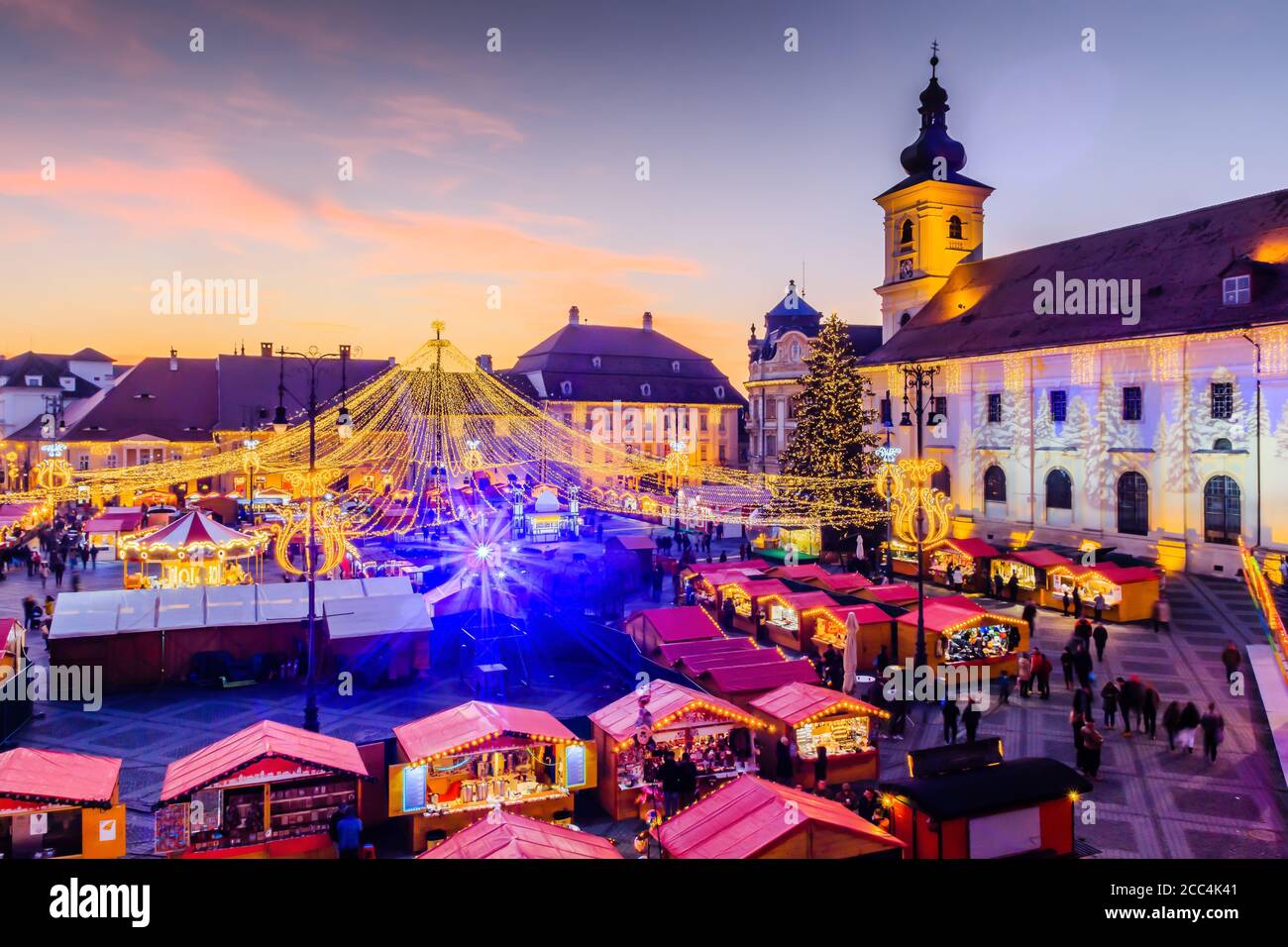 Sibiu, Romania. Christmas Market in Piata Mare at twilight. Transylvania, Romania. Stock Photo