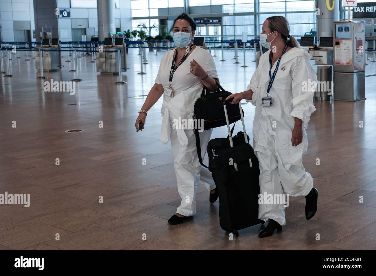 Lod, Israel. 18th Aug, 2020. Departing travellers queue at check in counters in Tel Aviv's Ben Gurion International Airport as Israel eases air travel restrictions opening skies for Israelis to travel quarantine free to and from Greece, Croatia and Bulgaria and allowed back from 17 other countries without quarantine. Tourists will be allowed to arrive quarantine free from several countries defined ‘green' and subject to reevaluation every two weeks. Credit: Nir Alon/Alamy Live News Stock Photo