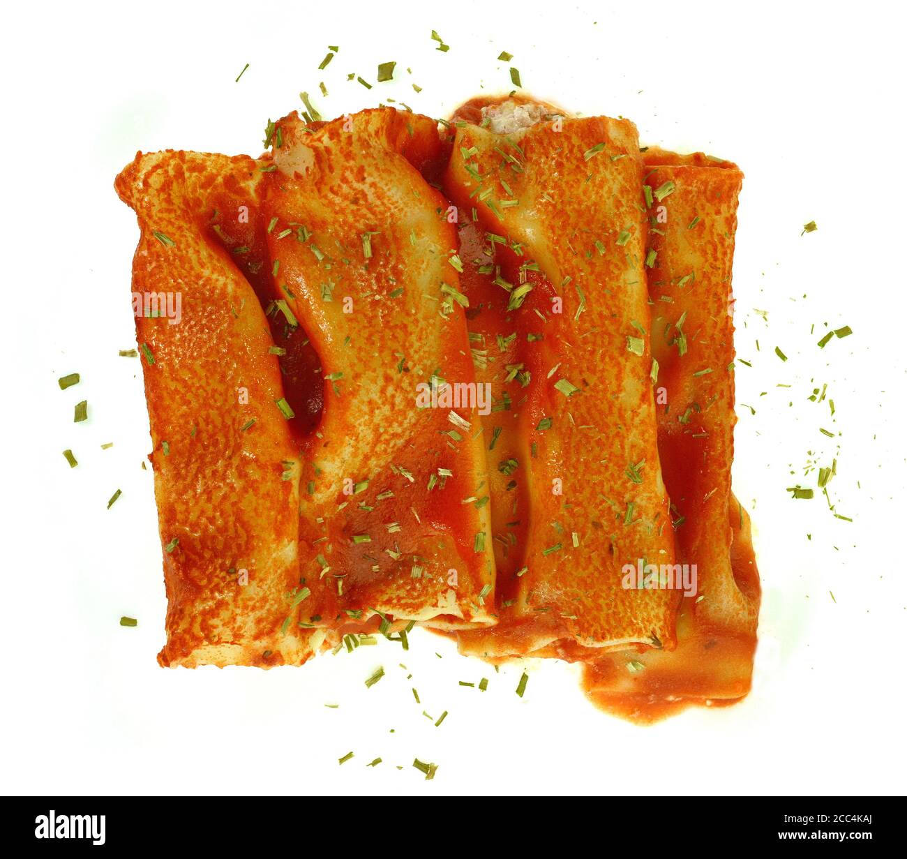 Canelones Italian Dish Bolognese with cheese and bechamel sauce. Delicious meat filled pasta on a plate on white background. Italian cannelloni Stock Photo