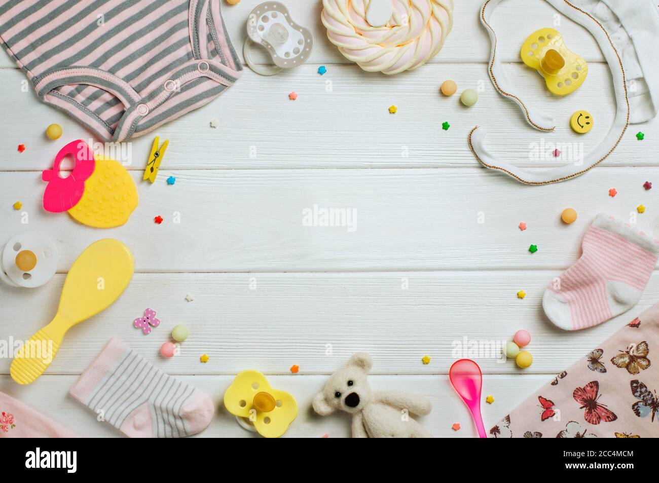 Baby accessories over white wooden background with copy space ...