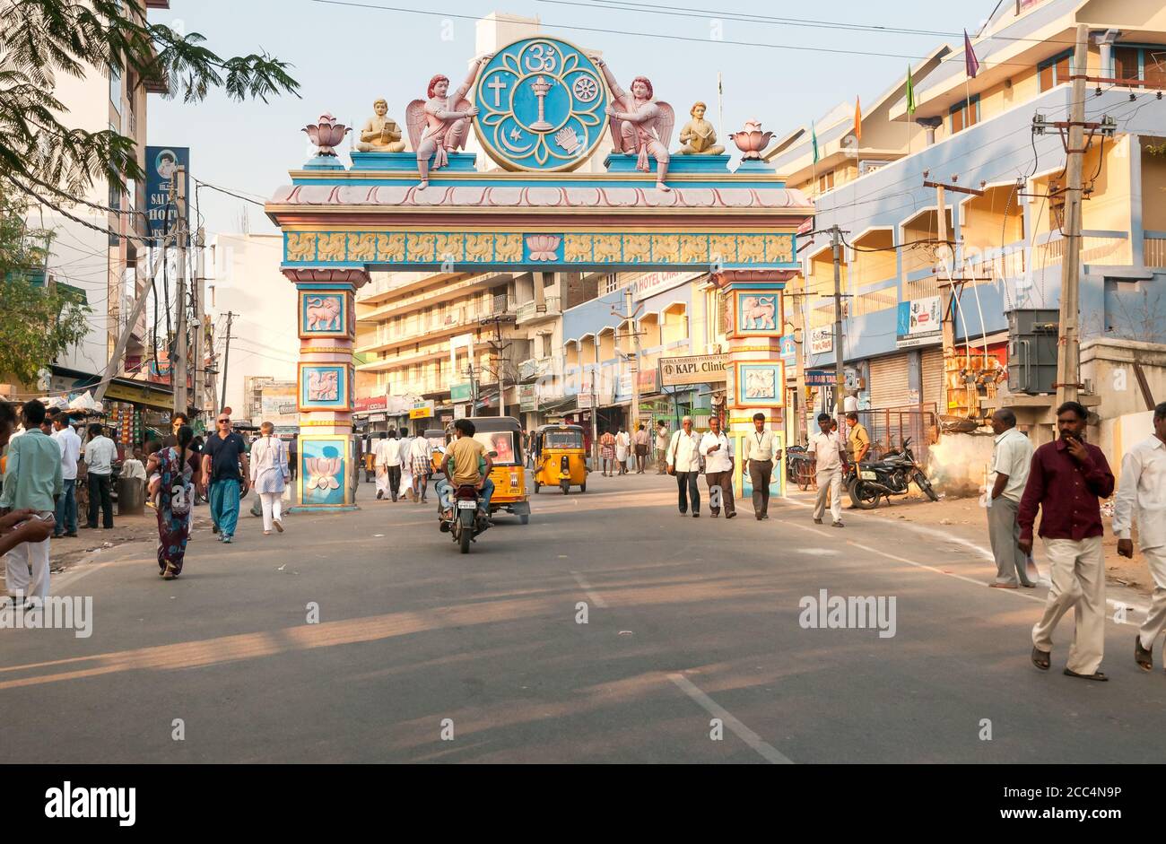 Puttaparthi, Andhra Pradesh, India - January 11, 2013: The symbolic archway to access Puttaparthi village, urban scene, India Stock Photo