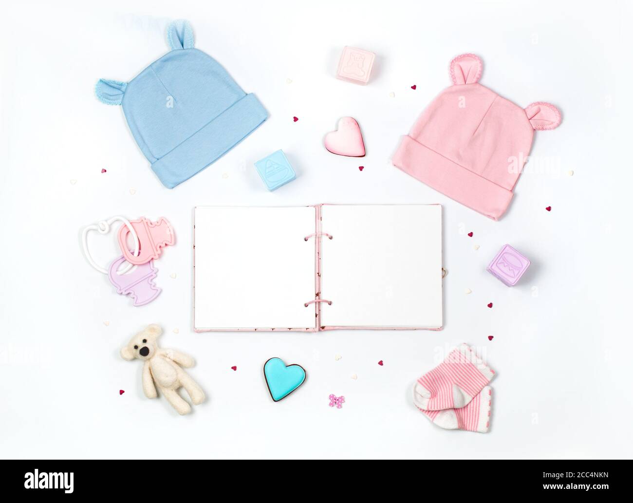 Baby shower party background with baby accessories and empty book on white  background Stock Photo - Alamy