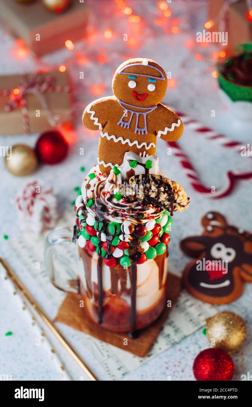 Christmas freak shake topping with gingerbread man, whipped cream and