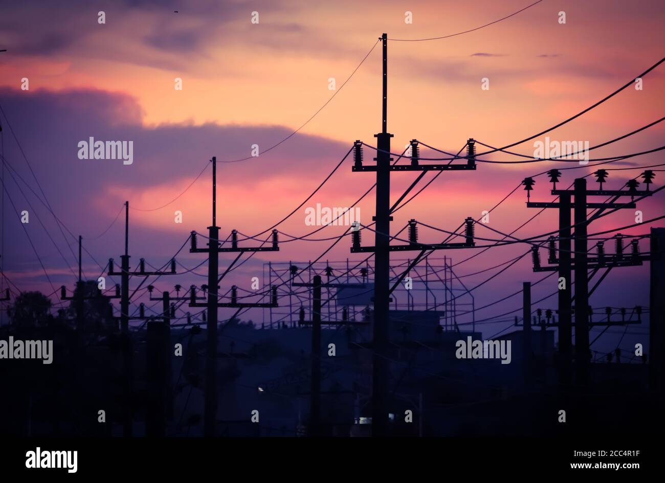 Silhouette high voltage electric tower and sky with clouds on sunset ...