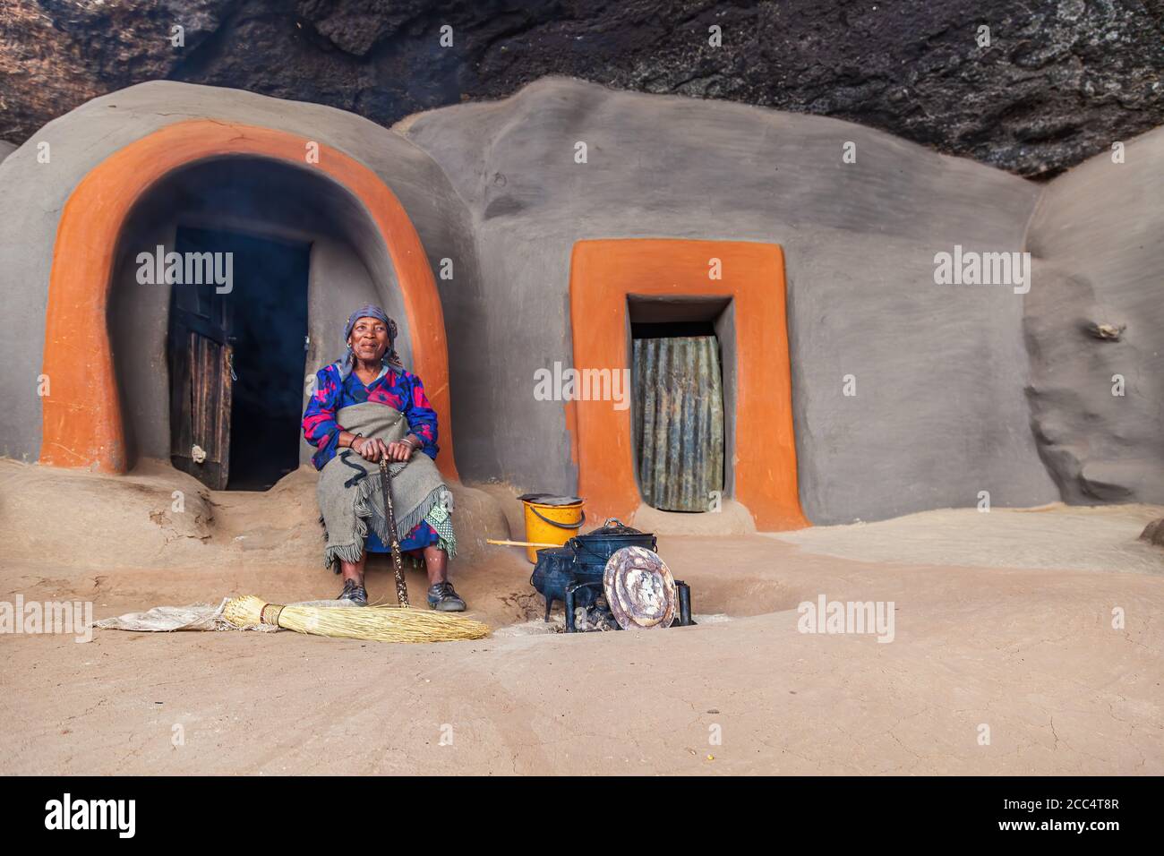 BEREA, LESOTHO - AUGUST 23, 2012: Indigenous woman in front of cave