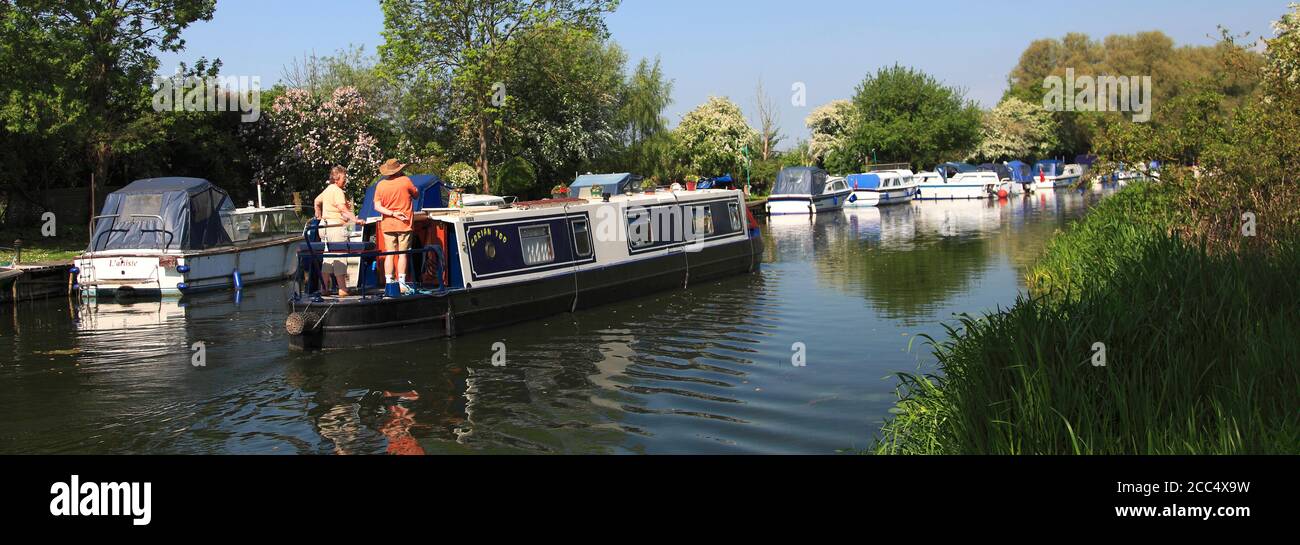 Narrowboats on the river Nene, near Castor village, Cambridgeshire County, England; UK Stock Photo