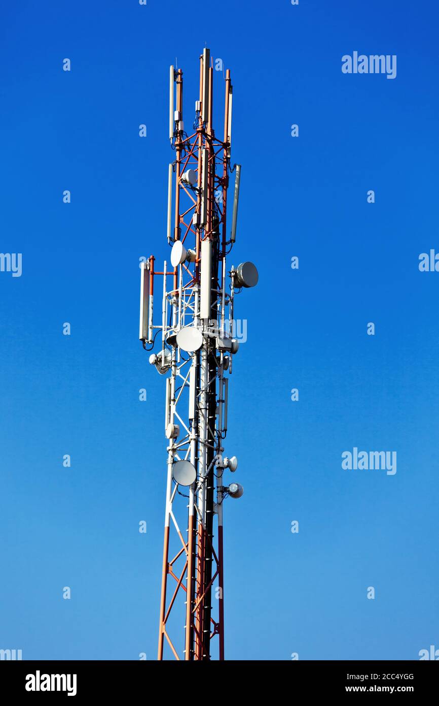 5G cell tower in front of blue sky, Germany Stock Photo - Alamy