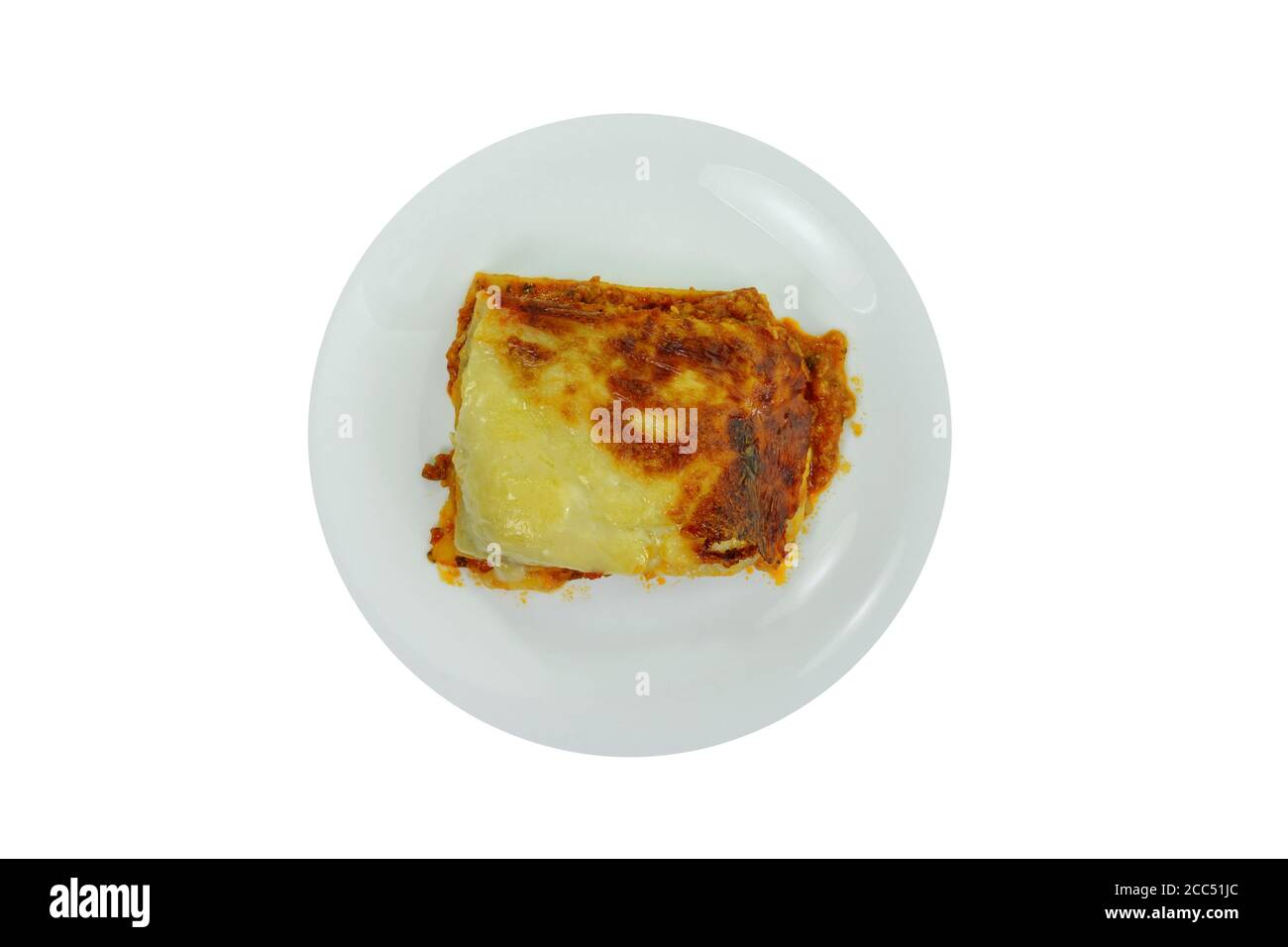 Portion of tasty lasagna. An isolated traditional lasagna made with minced beef bolognaise sauce. Tasty serving of traditional Italian lasagne with sp Stock Photo
