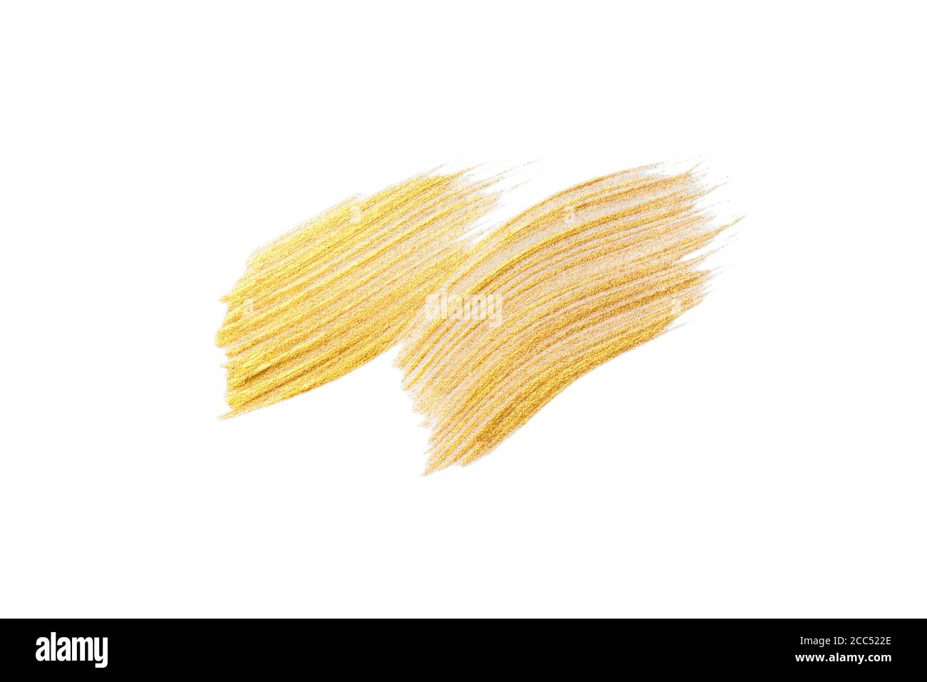 Gold acrylic brushstroke on a white background. Stock Photo