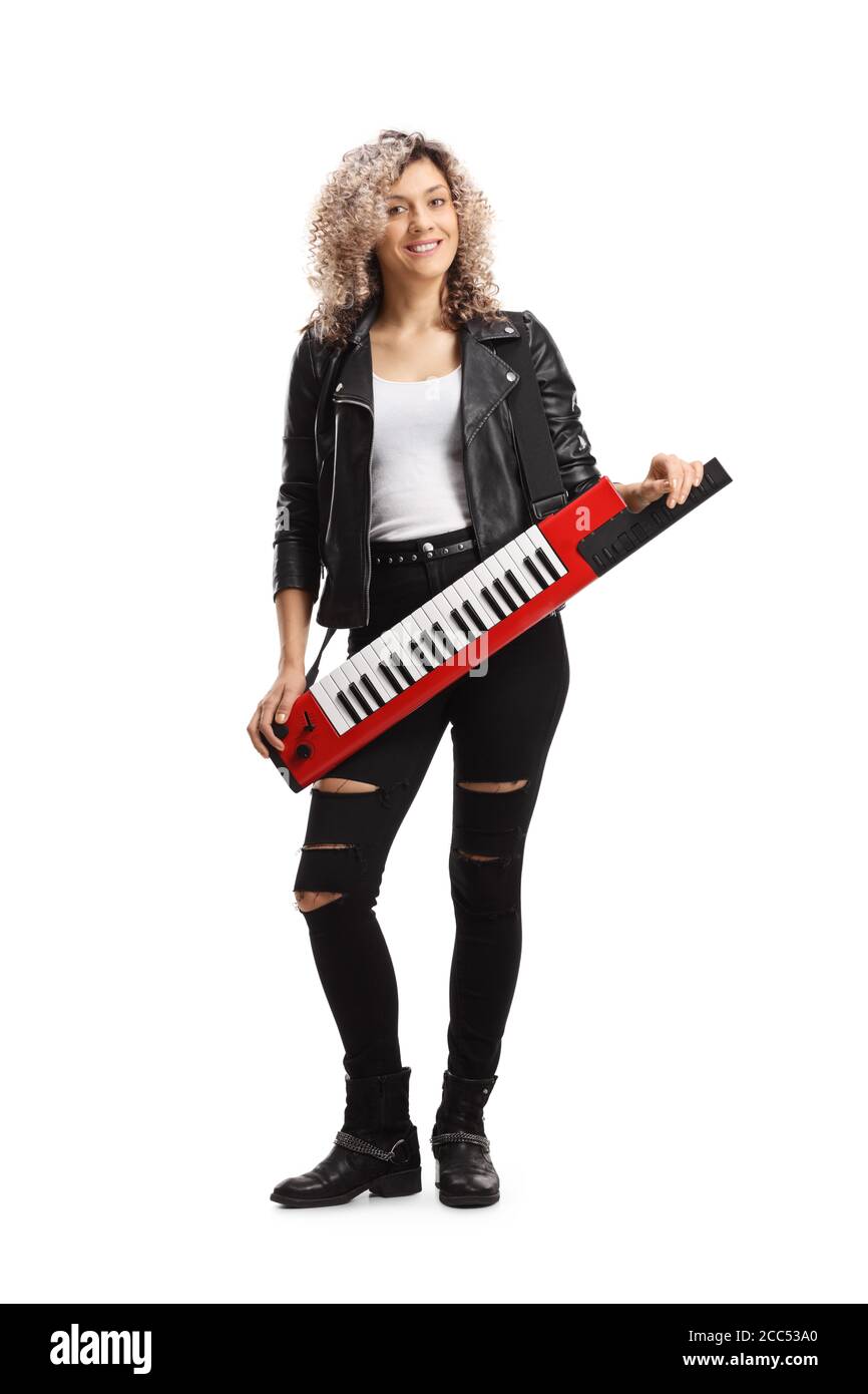 Full length portrait of a young woman standing with a keytar synthesizer isolated on white background Stock Photo