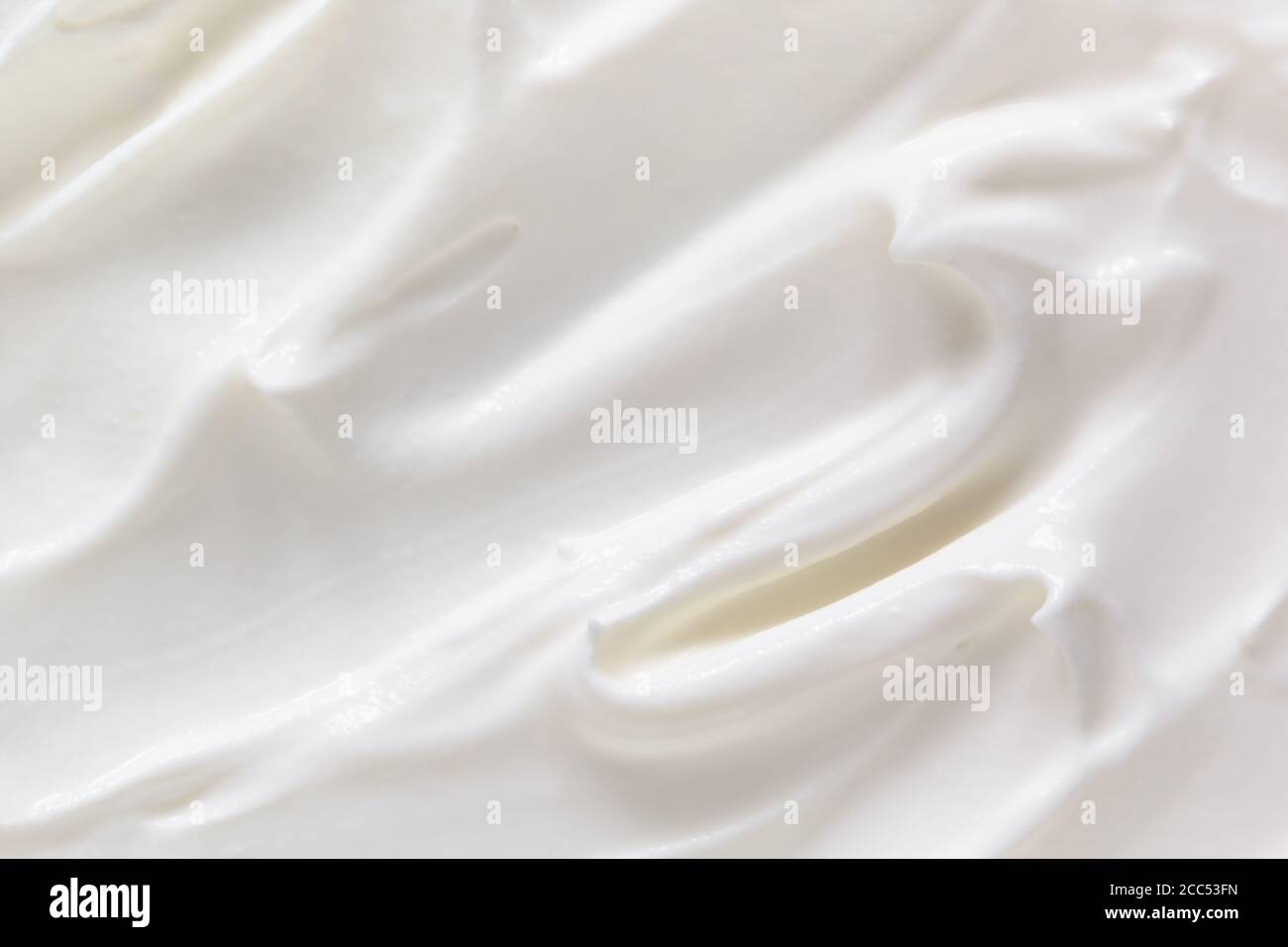 Cream texture background. Greek yogurt, sour cream closeup. White